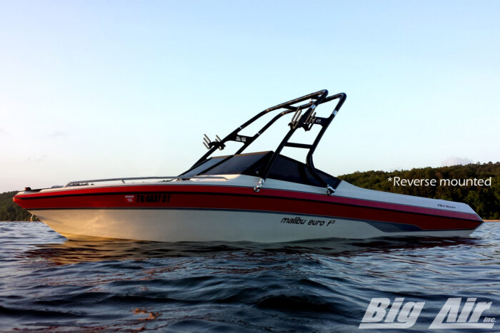 red and white malibu euro f3 boat on water with big air cuda wake tower. Tower is reverse mounted and equipped with razor racks