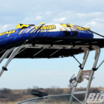Close up photo of a Four Winns boat with a Big Air Cuda tower and Tube Top bimini mounted on it