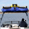 Close up photo of Four Winns boat with a Big Air Cuda tower and Tube Top bimini mounted on it