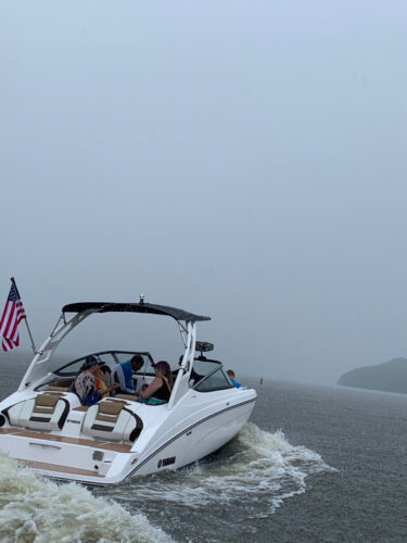 white 2022 yamaha 212s boat under way in a slightly stormy ski