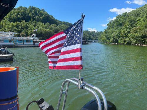 American flag waving mounted into a Big Air Flag Holder mounted on a pontoon wake tower