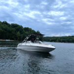 customer testimonial image of a 1999 Bryant 196 Limited boat with a Big Air Cuda tower and Tube Top bimini