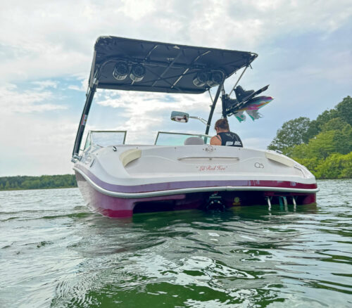 Tahoe boat showing the Big Air Ice tower, Super Shadow Bimini, Dual Bullet Speakers, and mirror mounted onto it.