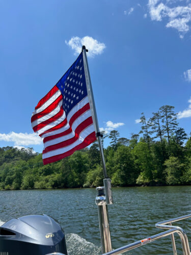 customer submitted photo of the Big Air Flag Holder mounted onto the boat pylon