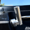big air hull mounted flag holder mounted on the rear of a black boat