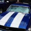 A blue Camaro with white stripes showcasing the Big Air Collapsible Car Shade