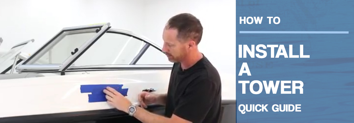 man in a black shirt is standing next to a boat that is taped off ready to start a wakeboard tower installation